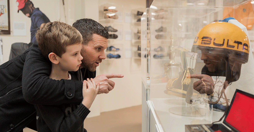 Family browsing through the Wagga Wagga Sporting Hall of Fame on display at the Museum of the Riverina Botanic Gardens site