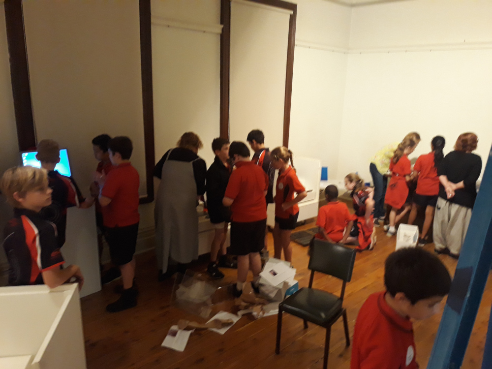 Junior curators installing their exhibitions